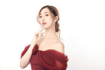 A beautiful young Asian woman with clean, fresh skin against a white background. Skincare, facial...