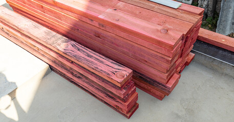 Close-up of a wooden frame for a new construction project. The frame rests on a concrete...