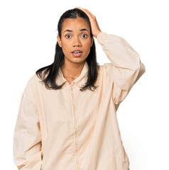 Young Filipina woman being shocked, she has remembered important meeting.
