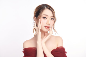 A beautiful young Asian woman with clean, fresh skin against a white background. Skincare, facial...