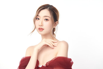 A beautiful young Asian woman with clean, fresh skin against a white background. Skincare, facial...