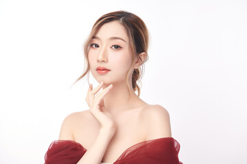 A beautiful young Asian woman with clean, fresh skin against a white background. Skincare, facial...