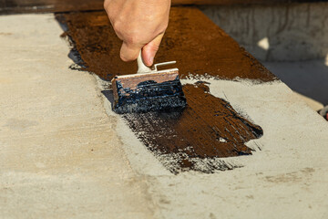 Construction techniques for waterproofing basement and foundations. Insulation material on the...