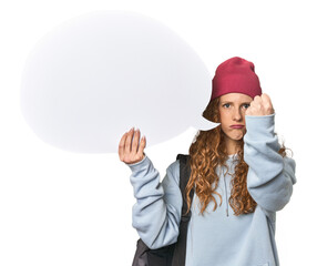 Redhead holding a comic speech bubble showing fist to camera, aggressive facial expression.