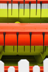 Abstract background, agricultural machinery and white picket fence