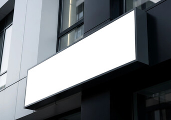 Fototapeta premium Blank Signboard on Contemporary Urban Building Facade for Branding and Advertisement
