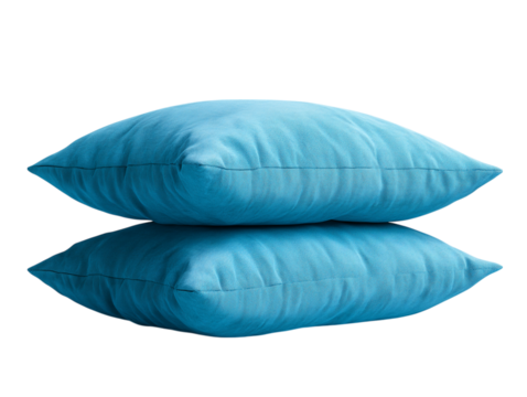 Two inviting blue pillows, stacked for optimal relaxation, exuding a sense of tranquility and restfulness