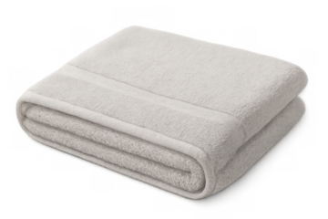 Pristine white towel neatly folded, symbolizing freshness and cleanliness in spa, bathroom, or hospitality settings