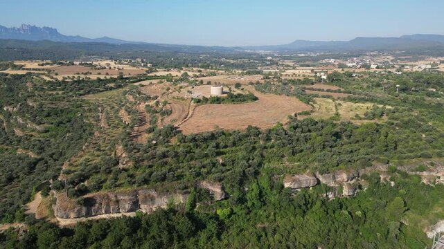 Aerial view of a landscape with mountains and fields, from El Bages, Catalonia