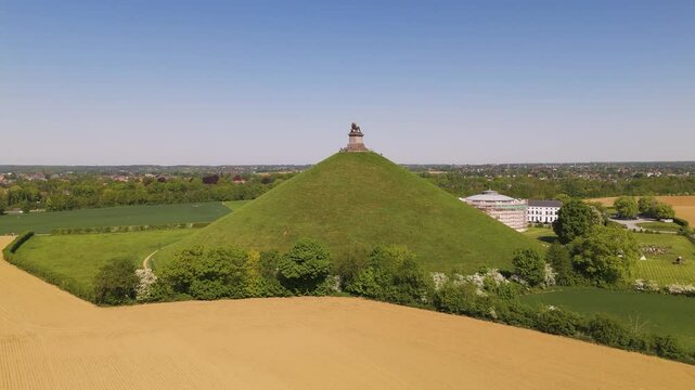 green cover ground iconic lion's mound waterloo belgium serene landscape natural area drawing drone panning shot leeuw van greenery historic beauty nature scenic attention 