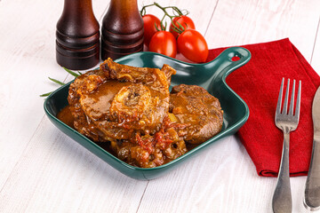 Italian cuisine - ossobuco with sauce