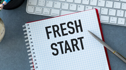 A notebook with the word Fresh Start written on it