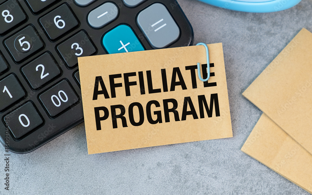 Poster a calculator sits on a table with a piece of paper that says affiliate program