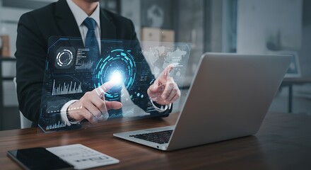 Businessman in suit interacting with holographic data interface projected above laptop, analyzing charts and graphs for business insights.