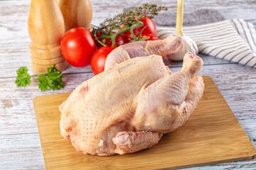 Raw whole uncooked organic chicken