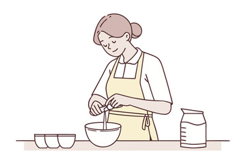 A woman wearing an apron carefully adds an ingredient to a bowl while preparing food in a kitchen setting