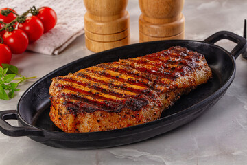 Grilled pork steak with bone