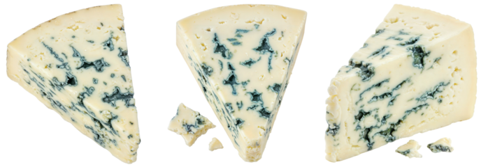 a collection of gourmet french roquefort cheese wedges with blue veins