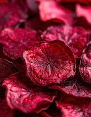Fototapeta premium Close-up of dried red beet slices creating a vibrant textured pattern
