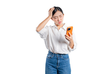 A stressed and worried young Asian woman holds her phone and touches her head, looking at the camera with a frustrated expression at a problem or issue she is encountering online.
