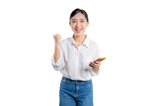 Asian woman holding a smartphone makes a fist pump gesture, celebrating a victory, receiving good news, or winning in a mobile game against a png background.