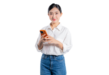 Asian woman in a casual outfit holds a smartphone with both hands and smiles warmly at the camera, representing modern communication and happiness against a png background.
