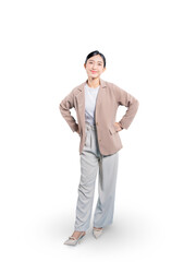 Fototapeta premium Asian businesswoman stands in a power pose with her hands on her hips, smiling at the camera with a look of success, determination, and empowerment.