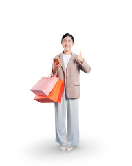 Full-length portrait of a happy young Asian woman holding shopping bags and her smartphone while pointing upwards, symbolizing an idea or inspiration related to online shopping.
