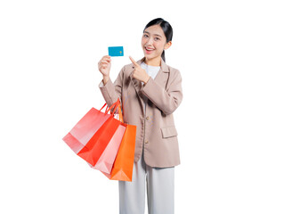 Asian woman holds colorful shopping bags and presents a smartphone with a blank white screen, ideal...