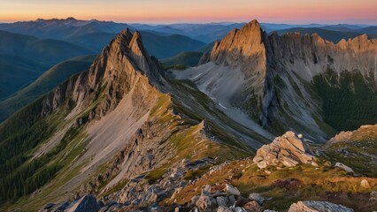 Dramatic mountain landscape at sunrise, showcasing sharp peaks and a gradient sky