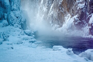 Frozen winter stream carving through a snow-covered canyon