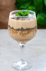 South African peppermint crisp tart in a glass on light grey