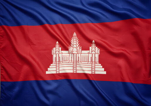 Cambodian Flag with Angkor Wat Temple Symbol on Red and Blue Waving Cloth Background.