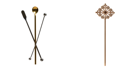 Decorative gold and brown cocktail stirrers stick on white background  