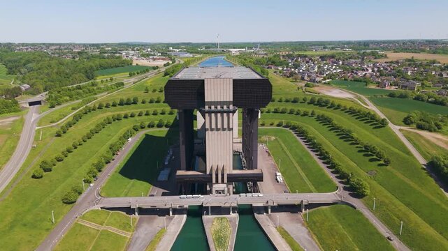 behind building str&eacute;py thieu boat lift structure le r&oelig;ulx hainaut belgium backdrop enhances visual appeal scene from forward drone shot str&eacute;py-thieu details landscape 