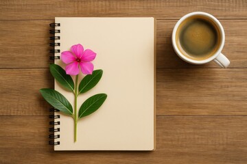 A floral notebook paired with a beverage on a rustic wooden surface