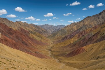 Naklejka premium Wide-angle landscape of vibrant peaks along the route to Ganda La Pass in Markha Valley Trek