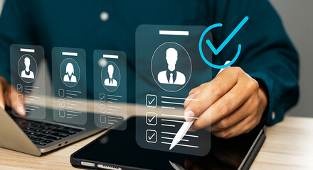 HR manager selecting digital candidate profile for recruitment using virtual interface on tablet and laptop