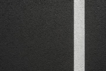 Fototapeta premium Fresh asphalt surface featuring a white line