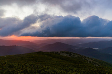 Clouds swirl over the mountains in the morning