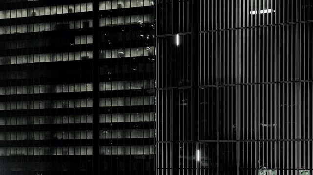 Night in Tokyo : Grids of Skyscrapers Overlap at Monochrome Night, with Transparent Elevator Descending to Lower Floors  |  Shibuya, Tokyo, Japan