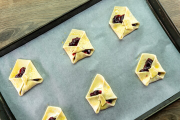 Envelopes from dough with jam. Puff pastry. Dessert