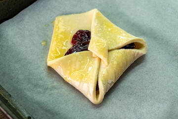 Envelopes from dough with jam. Puff pastry. Dessert