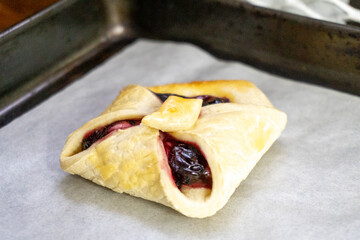 Envelopes from dough with jam. Puff pastry. Dessert