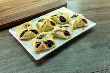 Envelopes from dough with jam. Puff pastry. Dessert