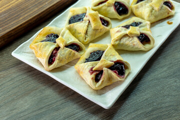 Envelopes from dough with jam. Puff pastry. Dessert
