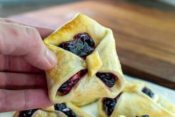 Envelopes from dough with jam. Puff pastry. Dessert