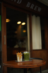 Closeup of Iced Caramel Macchiato at the coffee shop, Caramel Macchiato is a classic macchiato beverage. It consists of vanilla syrup, espresso, steamed milk, foam, and caramel drizzle