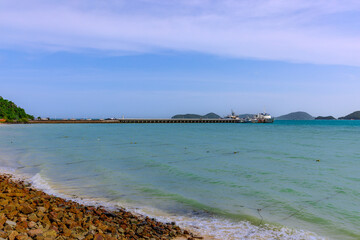 Turquoise blue waters and Lush green islands of the coast of Cape Panwa located on the eastern side of Phuket island in Thailand