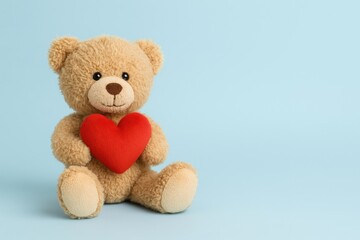 Obraz premium Adorable Plush Toy on a Blue Canvas with Space for Your Message